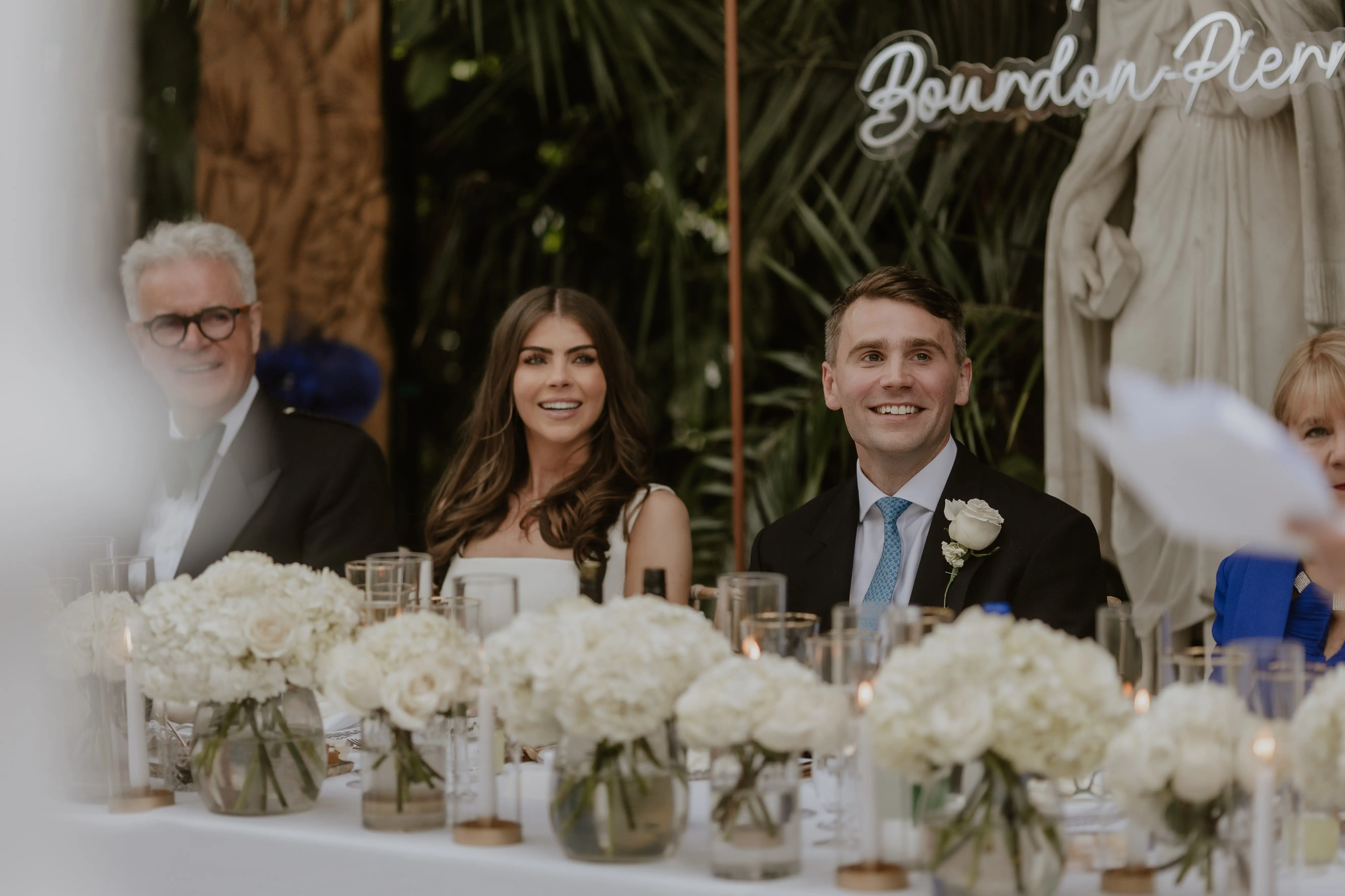 Sefton Park palm house Liverpool wedding venue set up with long top table and white wedding flowers